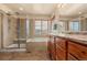 Main bathroom with soaking tub, shower, and wood cabinets at 7562 E 130Th Cir, Thornton, CO 80602