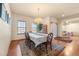 Formal dining room featuring hardwood floors, chandelier, and seating for six at 7562 E 130Th Cir, Thornton, CO 80602