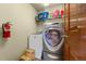 Convenient laundry room with washer, dryer, and shelving at 7562 E 130Th Cir, Thornton, CO 80602