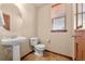 Small powder room with pedestal sink and tile flooring at 7562 E 130Th Cir, Thornton, CO 80602