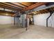 Unfinished basement featuring exposed ceiling and a concrete floor at 7944 E Lowry Blvd, Denver, CO 80230