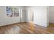 Bright bedroom with hardwood floors, large window and built-in shelves at 7944 E Lowry Blvd, Denver, CO 80230