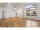 Open concept dining area with hardwood floors and large windows at 7944 E Lowry Blvd, Denver, CO 80230