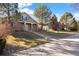 Two-story house with a landscaped yard and attached garage at 7944 E Lowry Blvd, Denver, CO 80230