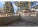 Private outdoor patio area enclosed with a wood fence, perfect for outdoor enjoyment at 7944 E Lowry Blvd, Denver, CO 80230