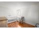 Charming bedroom with crib and rocking chair at 6505 Kalua Rd # 204B, Boulder, CO 80301