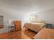 Spacious bedroom with wood floors and large bed at 6505 Kalua Rd # 204B, Boulder, CO 80301