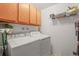 Convenient laundry room with washer, dryer, and cabinets at 6505 Kalua Rd # 204B, Boulder, CO 80301