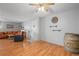 Living room with hardwood floors, a decorative barrel, and a clock at 6505 Kalua Rd # 204B, Boulder, CO 80301