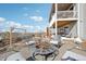 Outdoor patio area with fire pit and seating, complemented by a two-story deck at 20223 Terrace View Dr, Parker, CO 80134