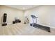 Carpeted basement area featuring home gym equipment and entertainment setup at 20223 Terrace View Dr, Parker, CO 80134