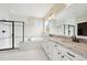 A well-lit bathroom features dual sinks with granite countertops and a walk-in shower with a black trim at 20223 Terrace View Dr, Parker, CO 80134