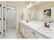 Bright bathroom features dual vanity, tile flooring, and a tub and shower combo with white tiles at 20223 Terrace View Dr, Parker, CO 80134