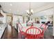 Bright dining area with hardwood floors, open to the kitchen and living room at 20223 Terrace View Dr, Parker, CO 80134