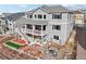 Aerial view of a beautiful two-story home with a large backyard and patio at 20223 Terrace View Dr, Parker, CO 80134