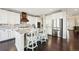 Beautiful kitchen featuring white cabinets, stainless steel appliances, and a kitchen island at 20223 Terrace View Dr, Parker, CO 80134