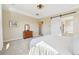 A spacious main bedroom features a tray ceiling, neutral colors, plush carpet and an ensuite bathroom with a barn door at 20223 Terrace View Dr, Parker, CO 80134