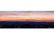 Panoramic vista featuring a striking orange sunset casting light over the distant mountains at 20223 Terrace View Dr, Parker, CO 80134