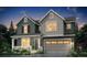Charming two-story home featuring board and batten and horizontal siding, a porch, and a two-car garage at 199 Wooten Ave, Brighton, CO 80601