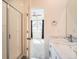 Bathroom view from doorway including marble vanity, glass shower and bedroom in the background at 12898 King St, Broomfield, CO 80020