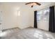 Bright bedroom featuring neutral walls, soft carpet, and sun-filled windows at 12898 King St, Broomfield, CO 80020