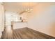 Open floor plan featuring wood flooring and seamlessly connects the dining area and kitchen at 12898 King St, Broomfield, CO 80020