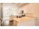 Well-equipped kitchen featuring granite countertops, stainless steel appliances, and wooden floor at 12898 King St, Broomfield, CO 80020