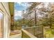 Charming deck area with outdoor seating, perfect for enjoying nature at 4850 Forest Hill Rd, Evergreen, CO 80439