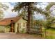 Inviting home featuring a covered deck and serene wooded surroundings at 4850 Forest Hill Rd, Evergreen, CO 80439