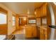 Updated kitchen with granite countertops, stainless steel appliances, and hardwood floors at 4850 Forest Hill Rd, Evergreen, CO 80439