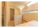 Efficient laundry area with shelving and ample natural light at 4850 Forest Hill Rd, Evergreen, CO 80439