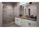 Contemporary bathroom with a large walk-in shower, dual vanity sinks, and modern fixtures at 1950 Grayside Cir, Castle Rock, CO 80109