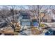 Aerial view of a home with solar panels and a two car garage on a sunny day at 7103 Depew Ct, Arvada, CO 80003