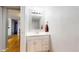 White bathroom sink and vanity in a well lit bathroom space at 7103 Depew Ct, Arvada, CO 80003