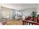 Neutral-toned room featuring a large bookshelf, cribs, and a play area at 7103 Depew Ct, Arvada, CO 80003