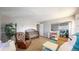 Neutral-toned room featuring a large bookshelf, cribs, and a play area at 7103 Depew Ct, Arvada, CO 80003