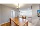 Dining room adjacent to the living room, creating an open and airy feel at 7103 Depew Ct, Arvada, CO 80003