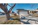 Charming two-story home featuring a two car garage, and well-maintained landscaping at 7103 Depew Ct, Arvada, CO 80003