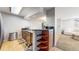 Kitchen featuring granite countertops, stainless steel appliances, and a view of the living area at 7103 Depew Ct, Arvada, CO 80003