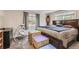 Bright bedroom with a large bed and plenty of natural light at 18128 Sage Brush Way, Brighton, CO 80603