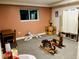 Playful room featuring a window, hardwood desk, crate, and a selection of rideable and stuffed toys at 18128 Sage Brush Way, Brighton, CO 80603