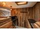 Close-up of custom-built basement bar with dark countertop and sink at 7018 Reed Ct, Arvada, CO 80003