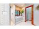 Bright bathroom features a separate tub and shower with custom tile details at 12655 Greenland Acres Rd, Larkspur, CO 80118