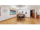 Dining room featuring wood floors and natural light; great for Gathering dinners at 12655 Greenland Acres Rd, Larkspur, CO 80118
