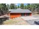 This beautiful home has a three-car garage and a deck perfect for entertaining at 12655 Greenland Acres Rd, Larkspur, CO 80118