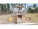 Charming greenhouse with an open door, nestled among the trees offering a perfect space for gardening enthusiasts at 12655 Greenland Acres Rd, Larkspur, CO 80118