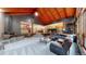 Open-concept living room with vaulted ceilings and a cozy fireplace at 12655 Greenland Acres Rd, Larkspur, CO 80118