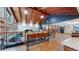 Open floor plan with hardwood floors, vaulted ceilings, custom lighting, and beautiful accents at 12655 Greenland Acres Rd, Larkspur, CO 80118