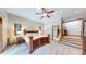 The main bedroom features wood trim, wooden furniture and comfortable carpet flooring at 12655 Greenland Acres Rd, Larkspur, CO 80118