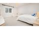 Bright bedroom with plush carpet, a comfortable seating area, and a large window for natural light at 44 N Big Meadow Trl, Franktown, CO 80116
